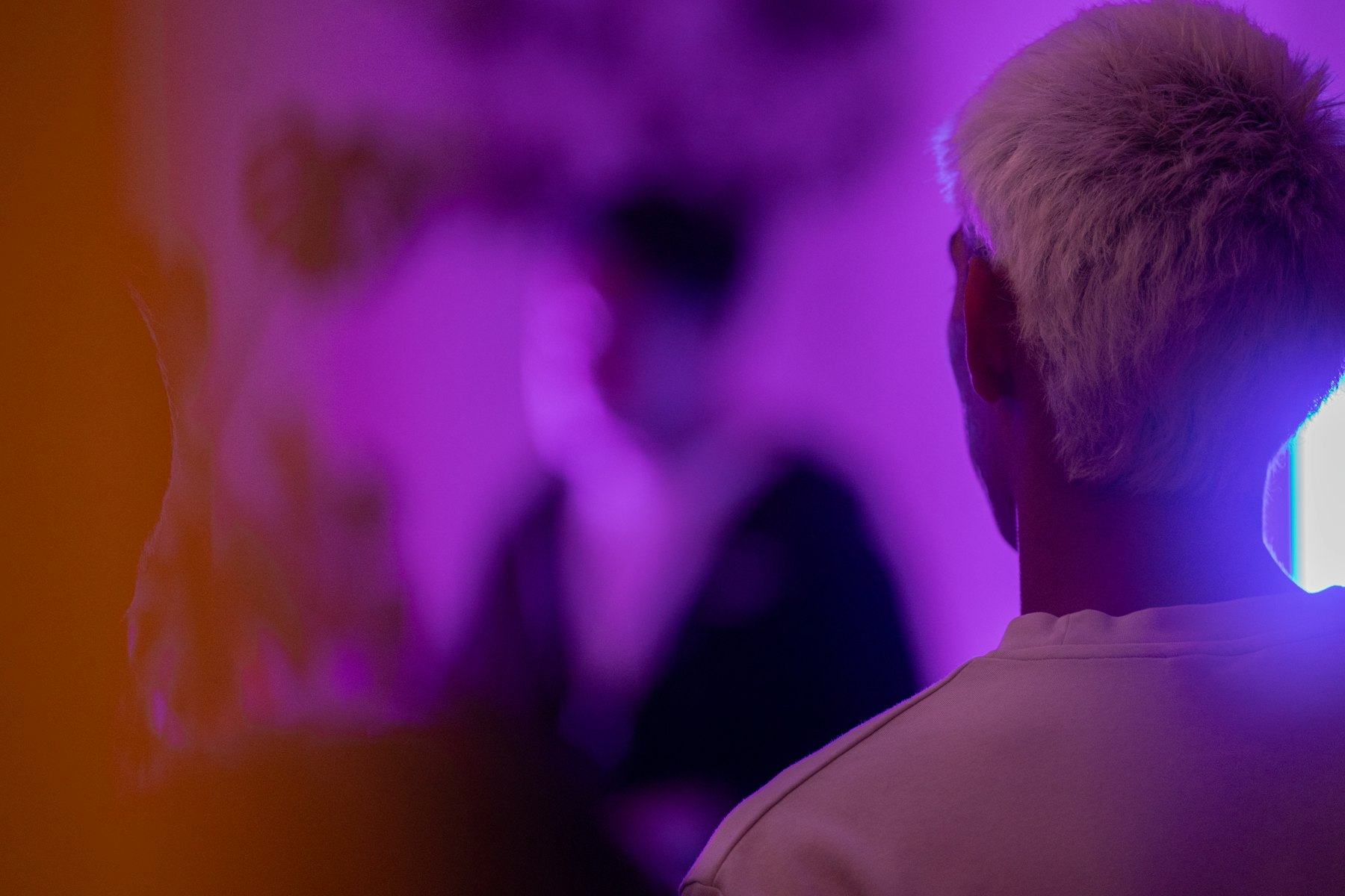 Talent lit in purple backstage before going on