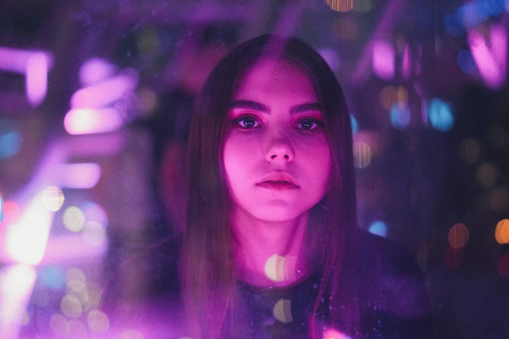 Public figure photographed in the lights of a venue