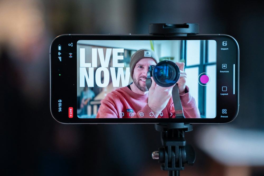 Creator live-streaming to a phone on a tripod